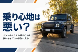 夕方の並木道を走る四角い大型SUV